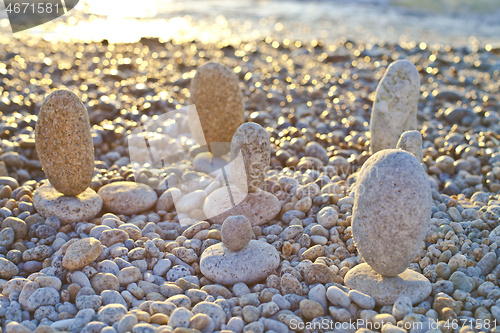 Image of Beautiful seascape, amazing view of pebble coastline in mild sun
