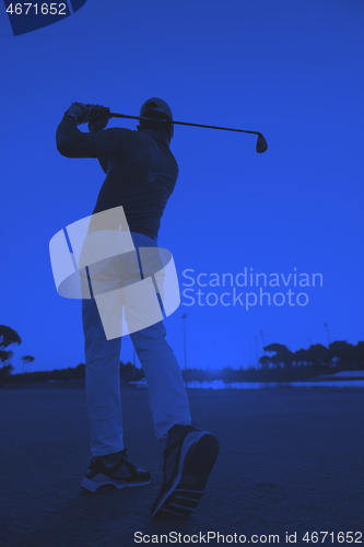 Image of golfer hitting long shot