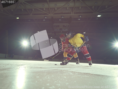 Image of teen ice hockey sport  players in action