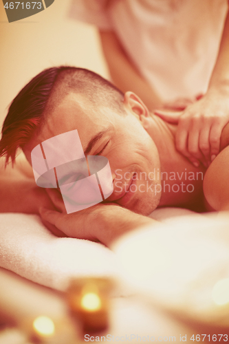 Image of man have relaxing massage