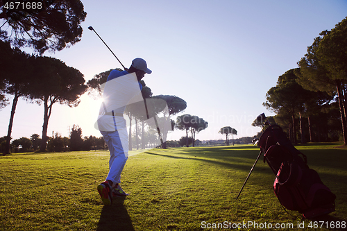 Image of golf player hitting long shot