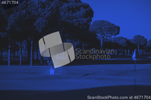 Image of pro golfer hitting a sand bunker shot