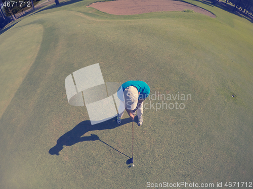 Image of top view of golf player hitting shot