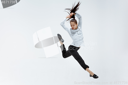 Image of Happy business woman dancing and smiling isolated on white.