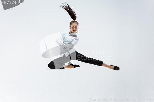 Image of Happy business woman dancing and smiling isolated on white.