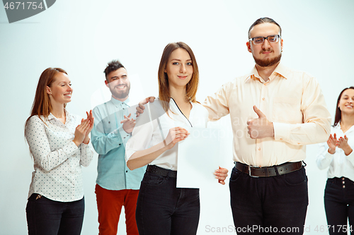 Image of Boss approving and congratulating young successful employee