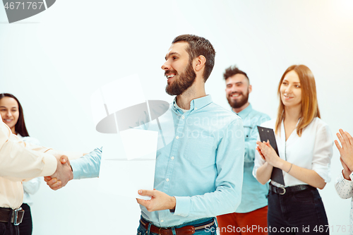 Image of Boss approving and congratulating young successful employee