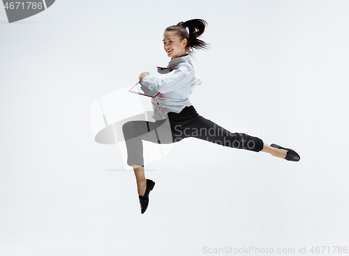 Image of Happy business woman dancing and smiling isolated on white.
