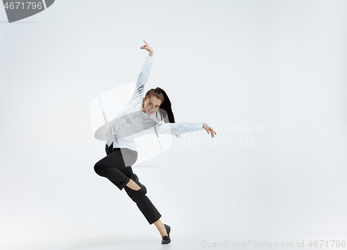 Image of Happy business woman dancing and smiling isolated on white.
