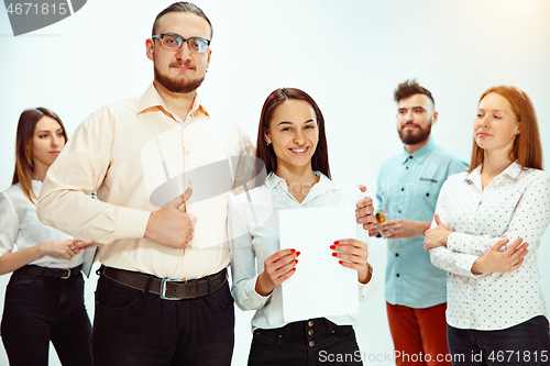 Image of Boss approving and congratulating young successful employee