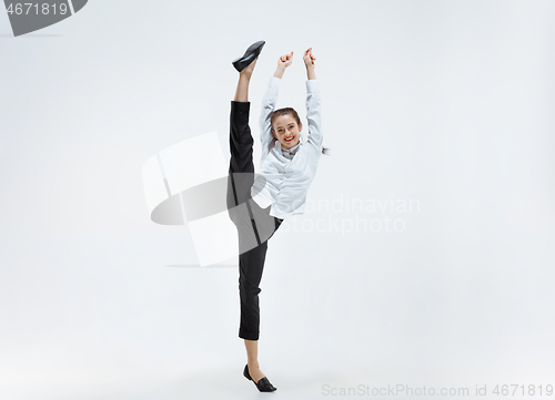 Image of Happy business woman dancing and smiling isolated on white.