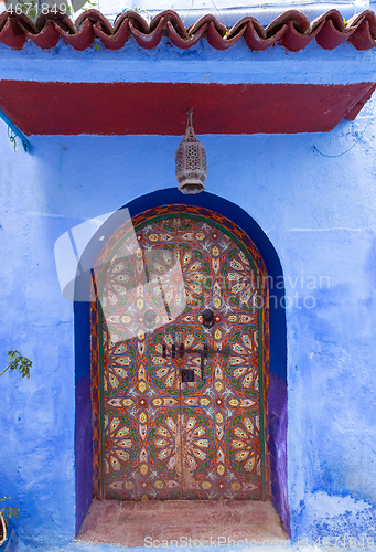 Image of ornate color door on street in Morocco