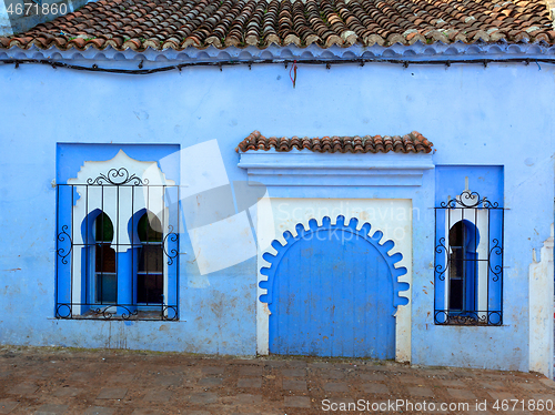 Image of house wall on blue street Chefchaouen