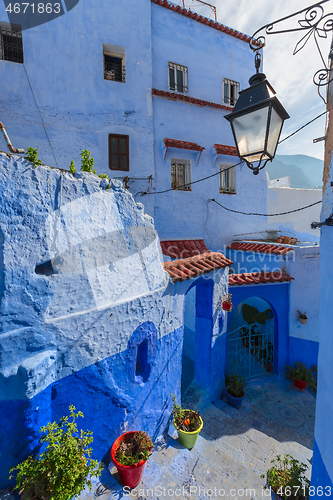 Image of Blue street with color pots in Chefchaouen