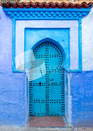 Image of Old blue door on street in Chefchaouen