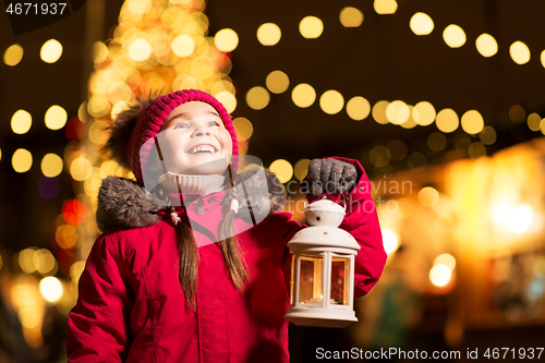 Image of happy little girl at christmas with lantern market