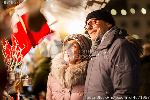 Image of senior couple at christmas market souvenir shop