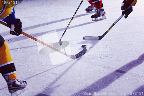 Image of teen ice hockey sport  players in action