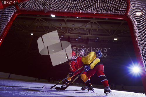 Image of teen ice hockey sport  players in action