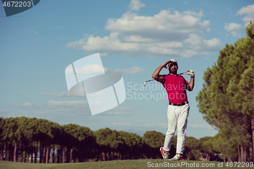 Image of golf player hitting long shot