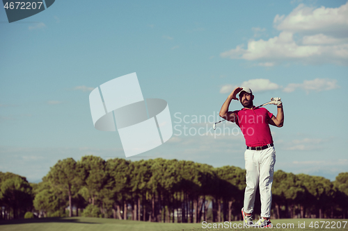 Image of golf player hitting long shot