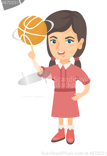 Image of Caucasian girl spinning basketball ball on finger.