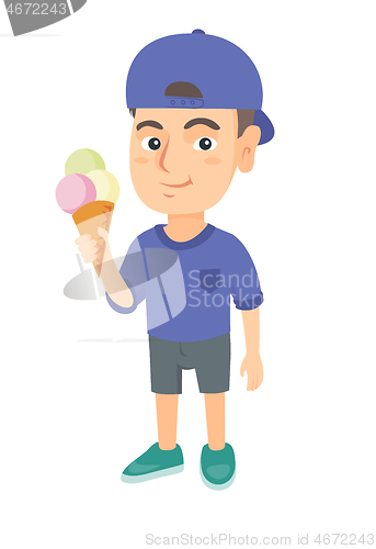 Image of Little caucasian boy holding an ice cream cone.