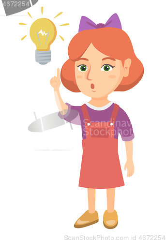 Image of Caucasian little girl pointing at the lightbulb.