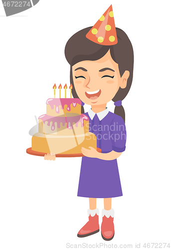 Image of Caucasian child holding birthday cake with candles