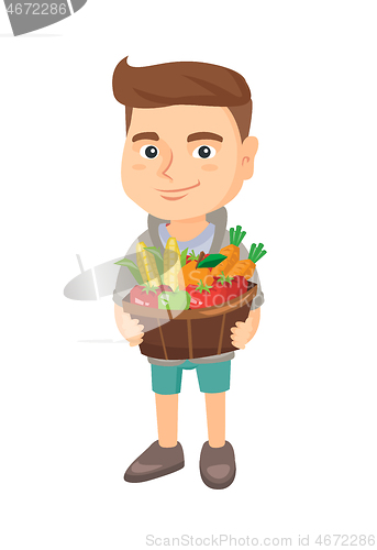 Image of Boy holding basket with fruit and vegetables.