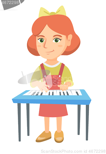 Image of Little caucasian girl playing the piano.