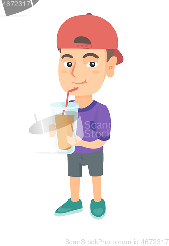 Image of Boy drinking orange juice through a straw.