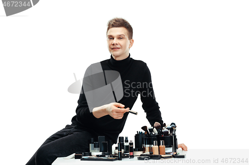 Image of Professional makeup artist isolated on white