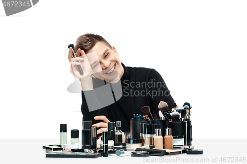 Image of Professional makeup artist isolated on white