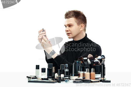 Image of Professional makeup artist isolated on white