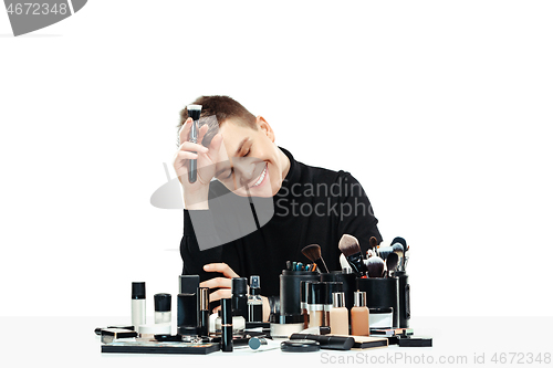 Image of Professional makeup artist isolated on white