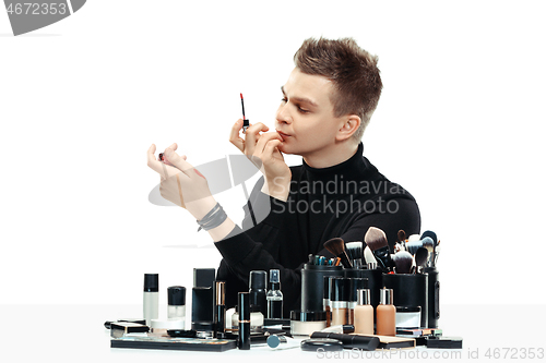 Image of Professional makeup artist isolated on white