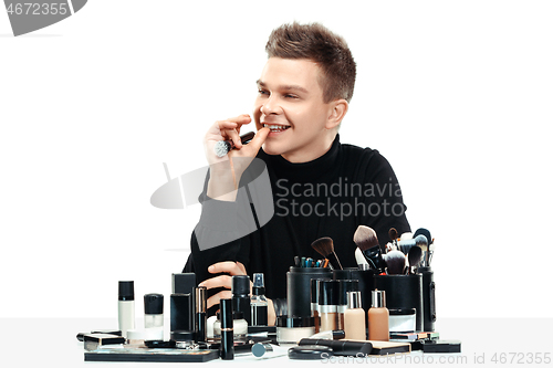 Image of Professional makeup artist isolated on white