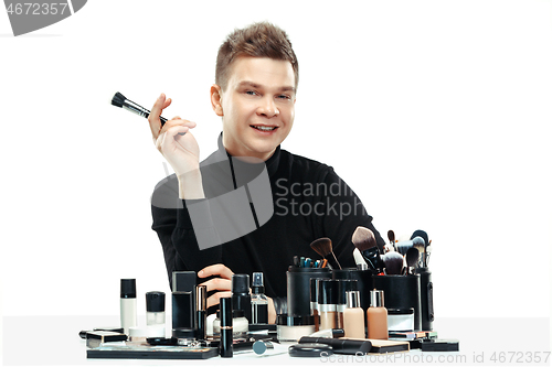 Image of Professional makeup artist isolated on white