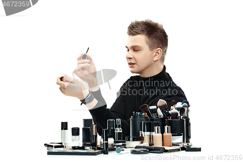 Image of Professional makeup artist isolated on white