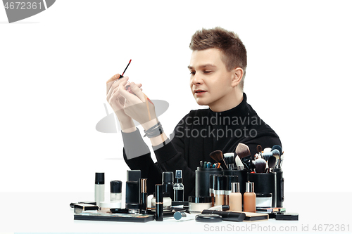 Image of Professional makeup artist isolated on white