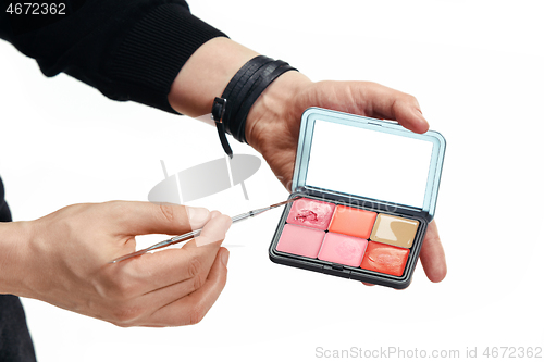 Image of Professional makeup artist working at salon