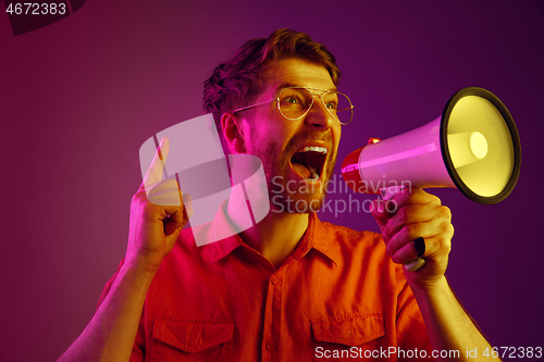 Image of man making announcement with megaphone