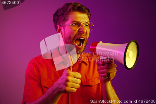 Image of man making announcement with megaphone