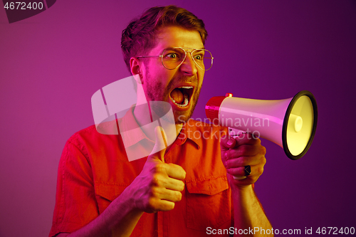 Image of man making announcement with megaphone