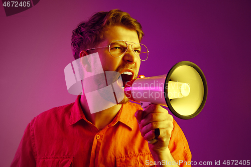 Image of man making announcement with megaphone