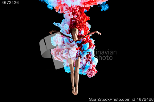 Image of Modern art collage. Concept ballerina\'s legs with colorful smoke.