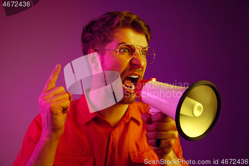 Image of man making announcement with megaphone