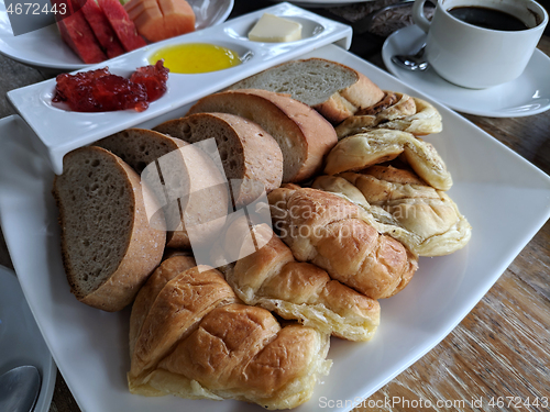 Image of Cup of tasty coffee with tasty breads