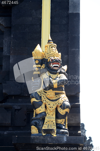 Image of Old hindu statue in outdoor at Tanah lot of Bali